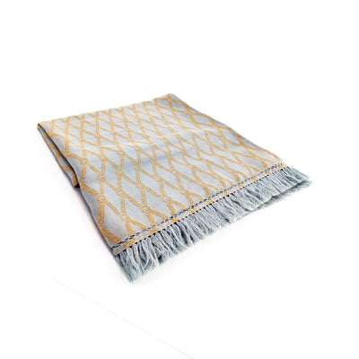 A bold weave, the metal horsebit, hand quilting and leather accents bring Equestrian Lifestyle effortlessly into the living area
