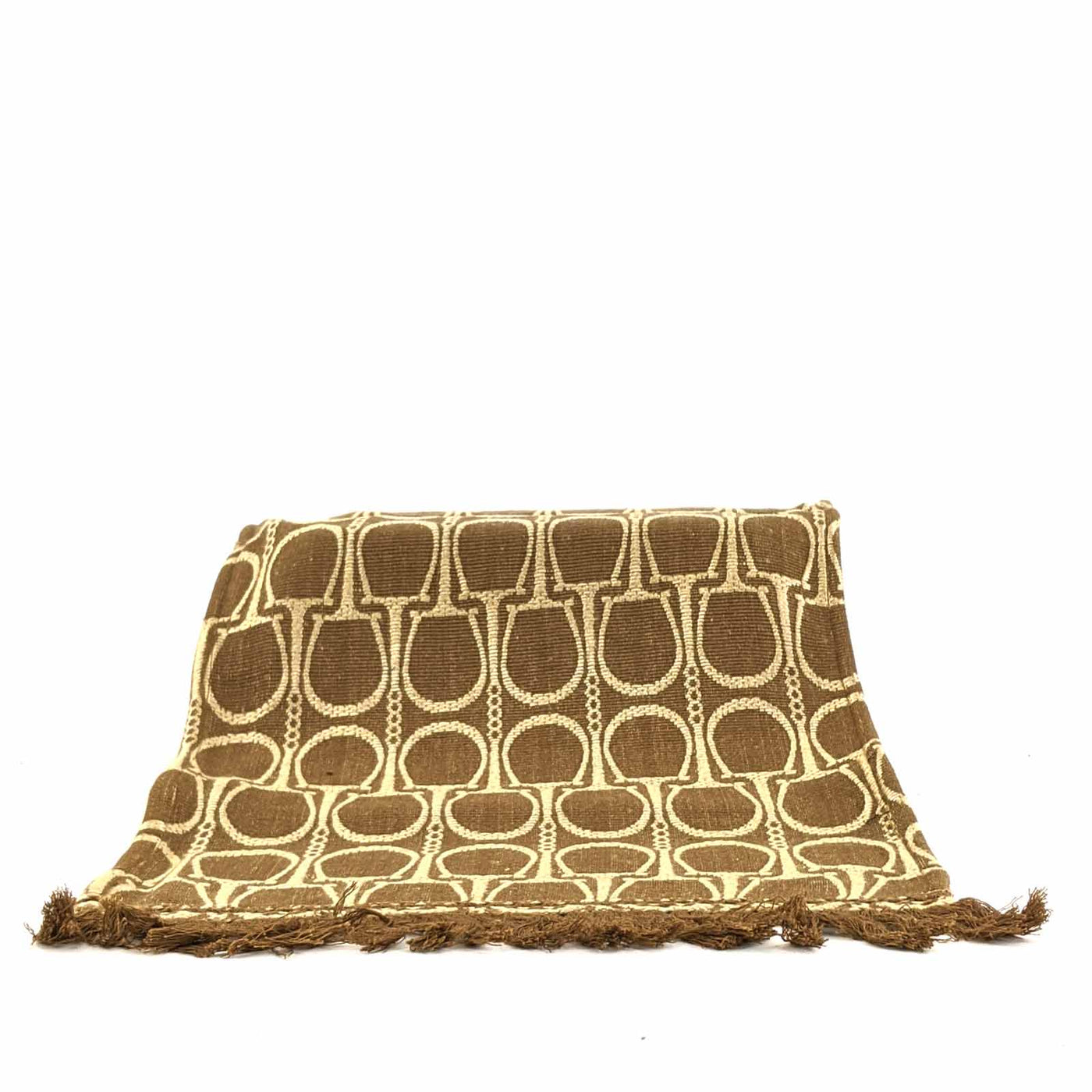 A bold weave, the metal horsebit, hand quilting and leather accents bring Equestrian Lifestyle effortlessly into the living area