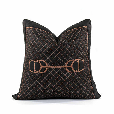 A bold weave, the metal horsebit, hand quilting and leather accents bring Equestrian Lifestyle effortlessly into the living area